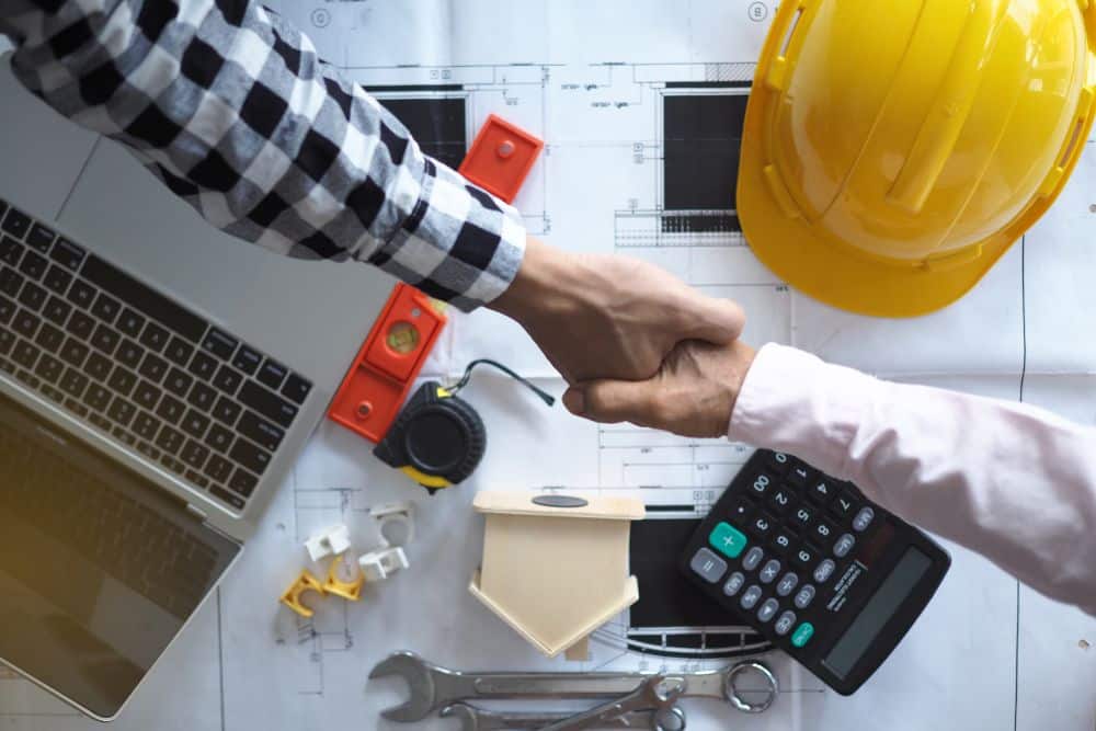 person shaking hands with a contractor