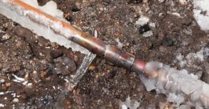 frozen and leaking sprinkler pipe