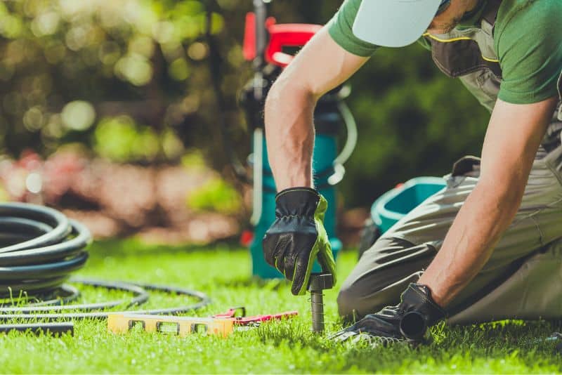 can I perform sprinkler system maintenance myself or should I hire a professional?